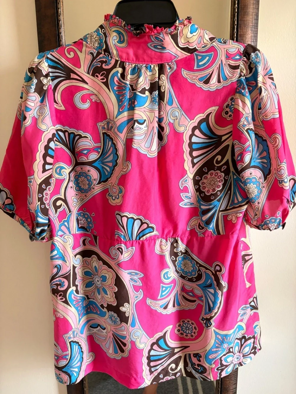100% Silk ruffle-neck blouse.